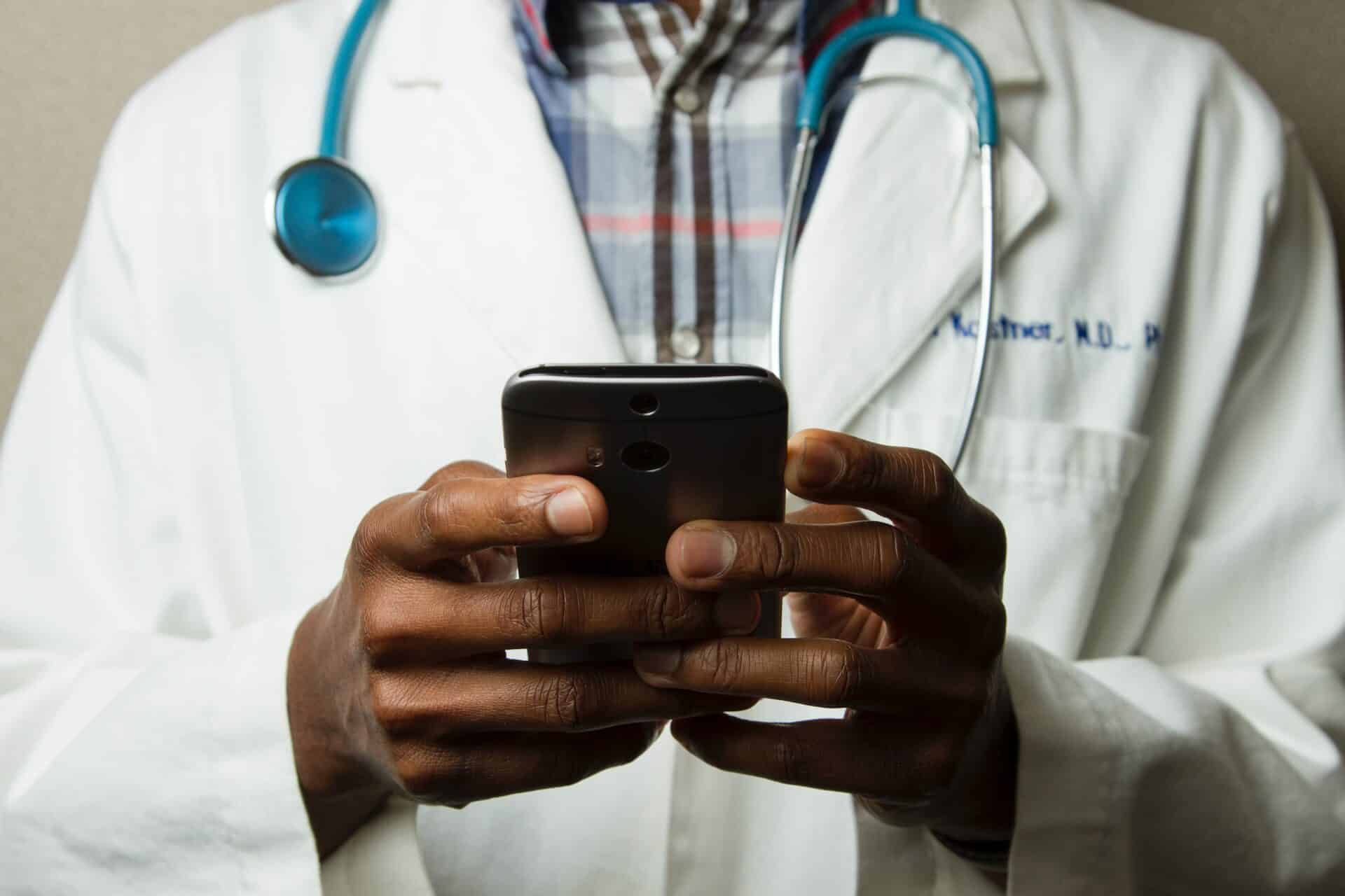 black doctor on mobile phone, black american cancer deaths